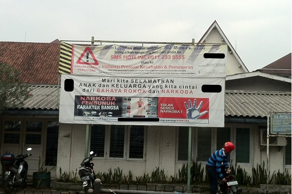 A National Narcotics Board poster displaying messaging from The International Day Against Drug Abuse and Illicit Trafficking 2014 in Indonesia / Lex Kuiper